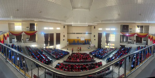 Panoramic view of the orientation hall and students